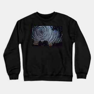 Starry night sky, startrails between trees landscape Crewneck Sweatshirt